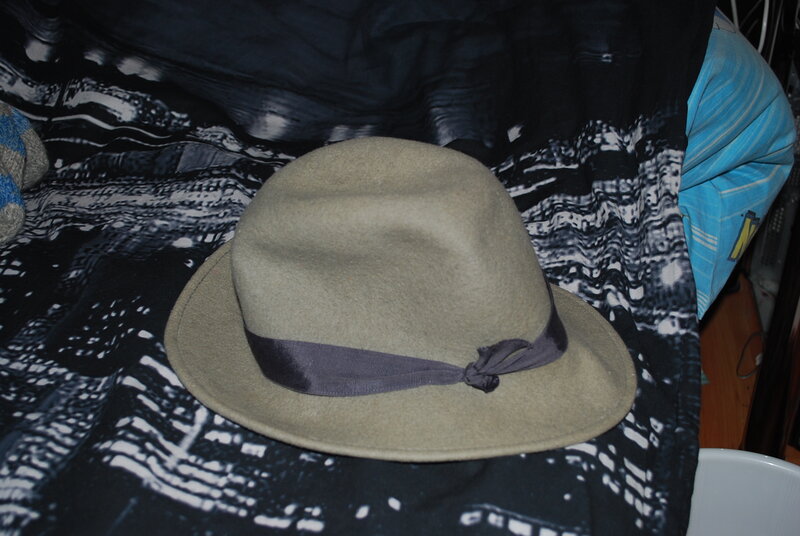 beige fedora hat with ribbon