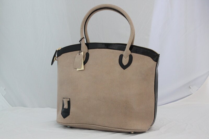 beige handbag with black trim