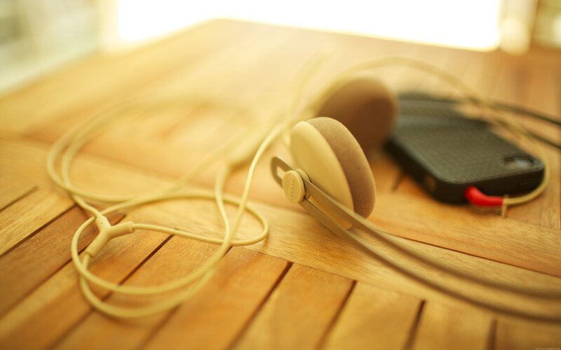 Beige Headphones on Table — Brown
