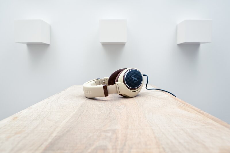 Beige Headphones on Table — White