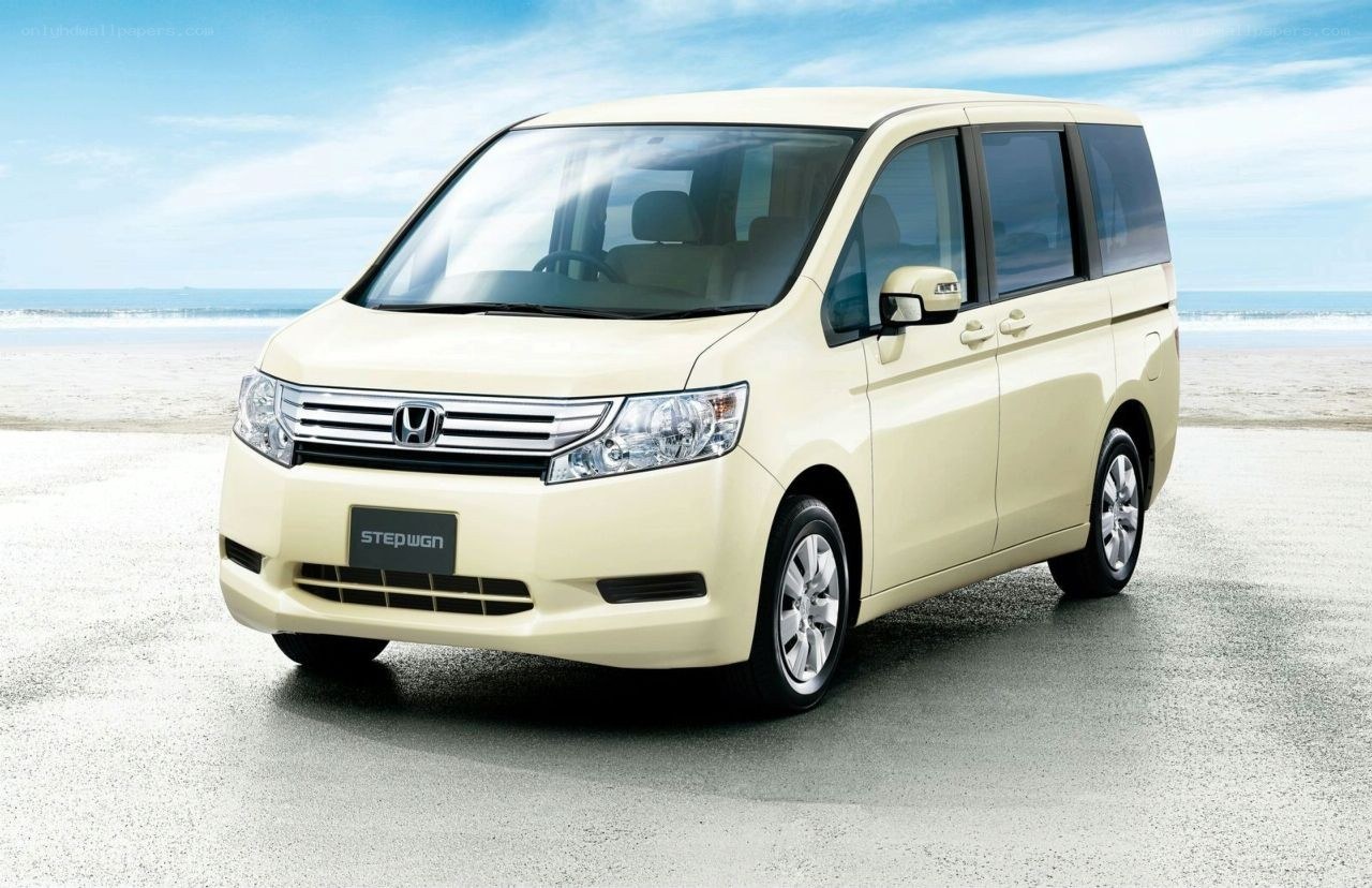 Beige Honda Stepwgn on beach
