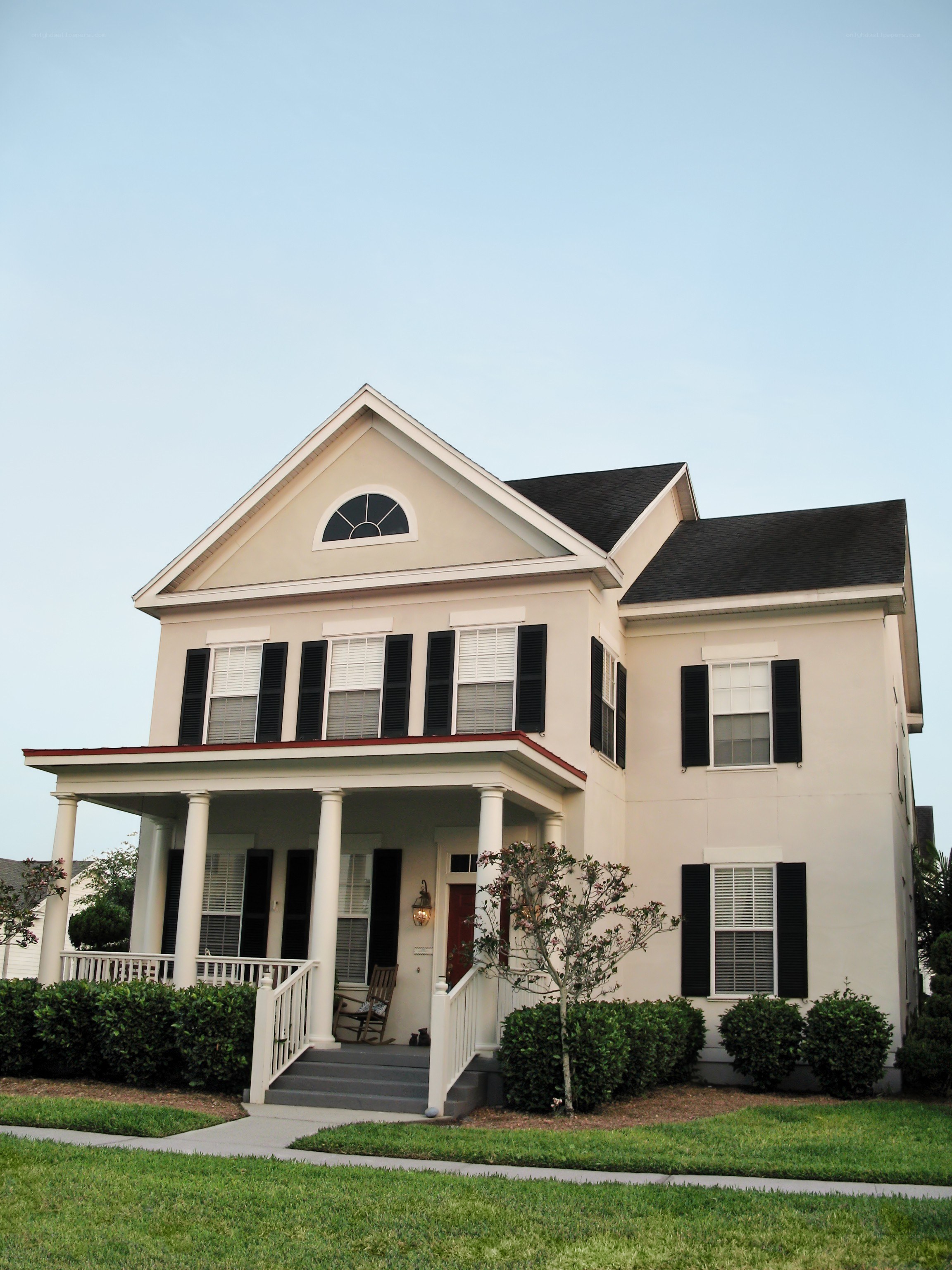 Beige house with black shutters