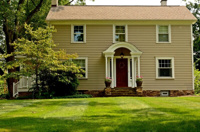Beige House with Red Door