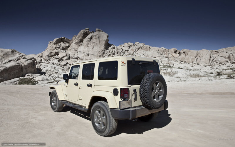 Beige Jeep in desert landscape