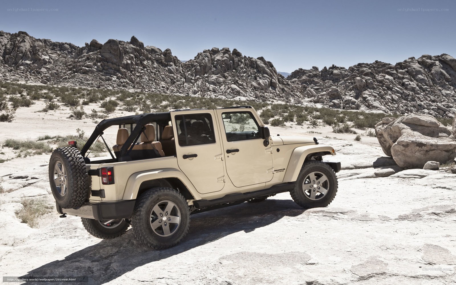 Beige Jeep in desert landscape