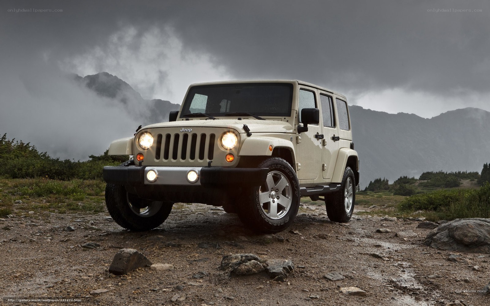 Beige Jeep in mountain landscape