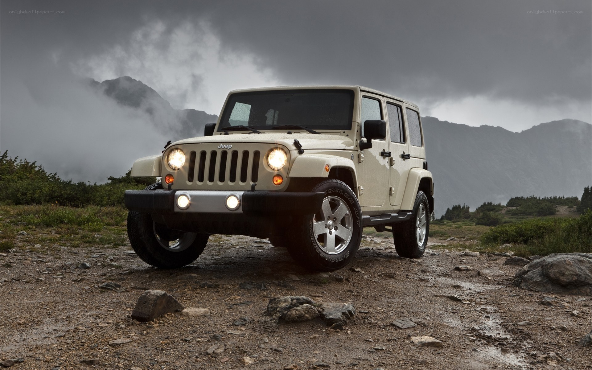Beige Jeep on a mountain trail