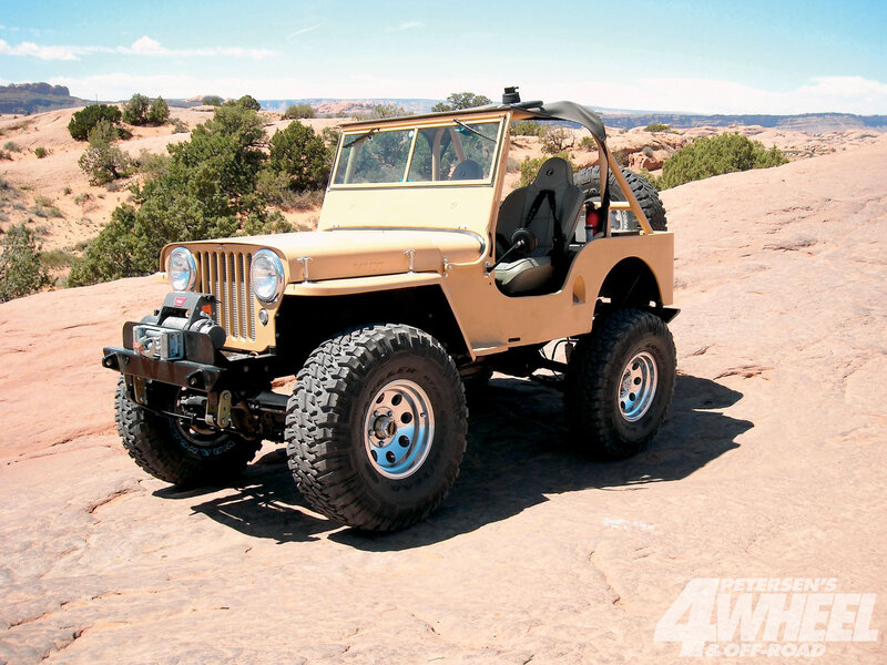 Beige Jeep on Rock
