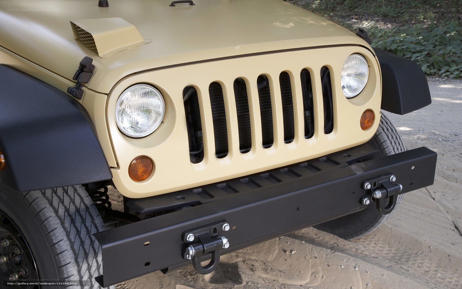 Beige Jeep Wrangler front view