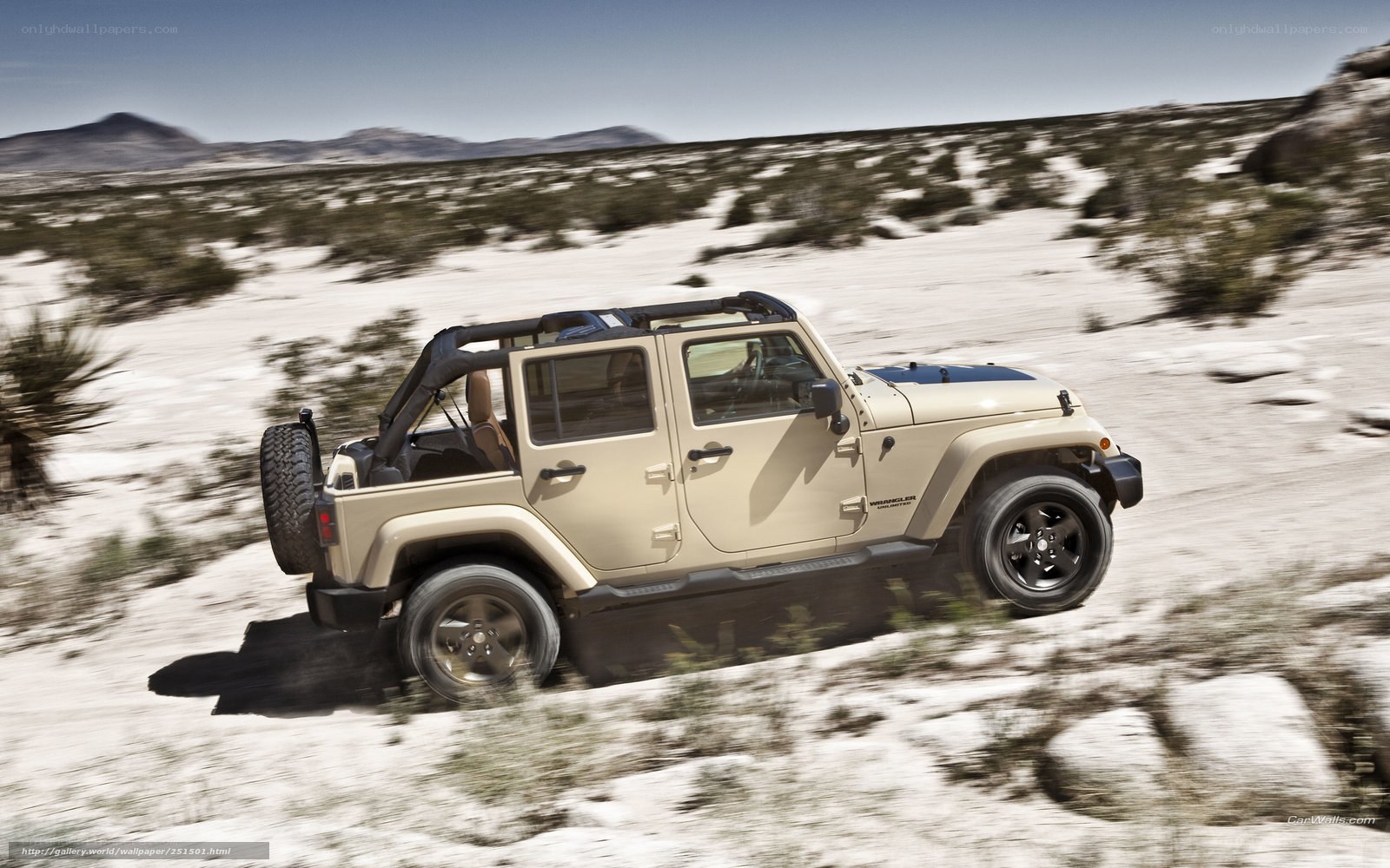 Beige Jeep Wrangler in desert