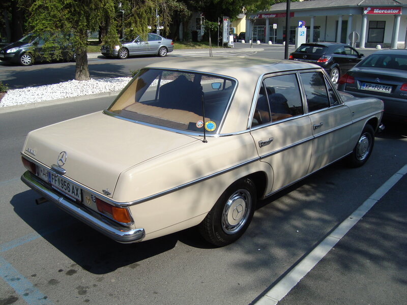 Beige Mercedes-Benz sedan parked