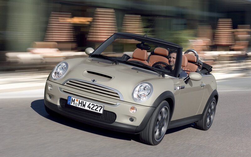 Beige MINI Convertible in motion