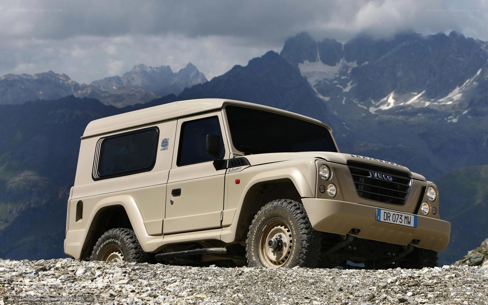 Beige off-road vehicle in mountains