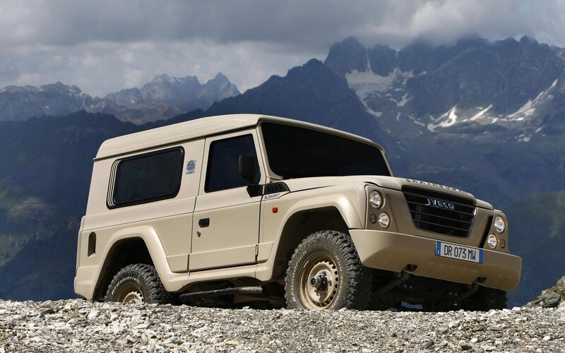 Beige off-road vehicle in mountains