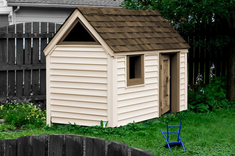 Beige Playhouse in Yard