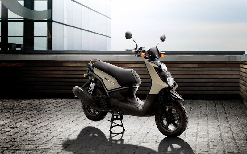 Beige scooter on cobblestone