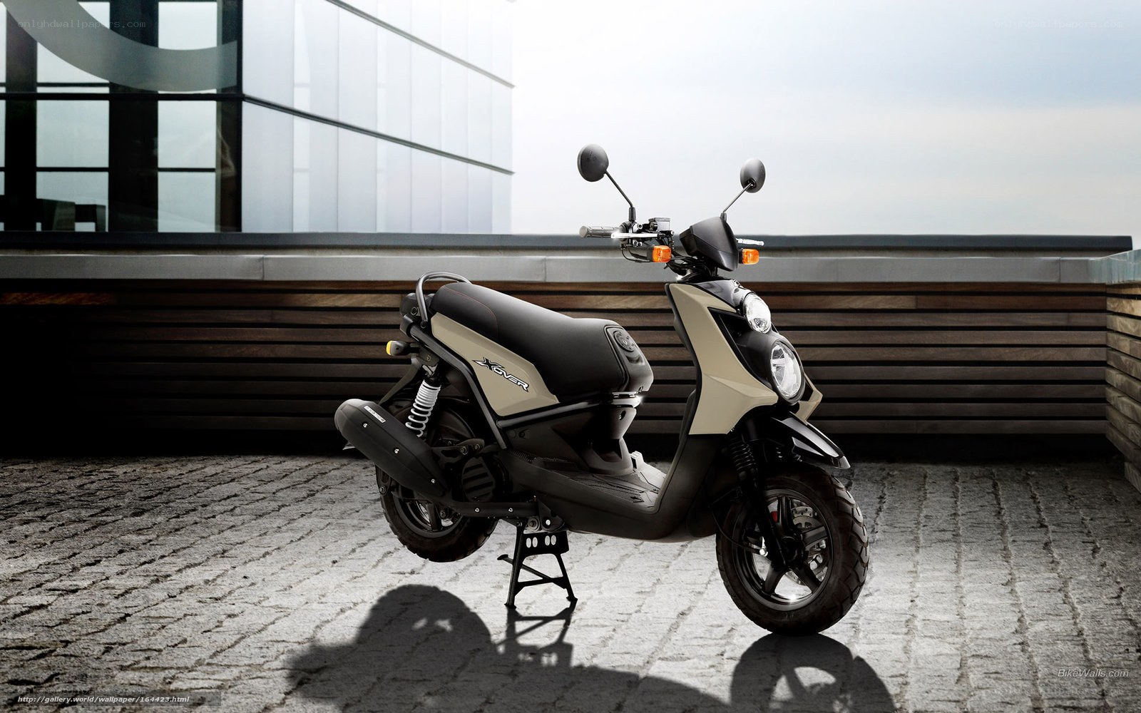 Beige scooter on cobblestone
