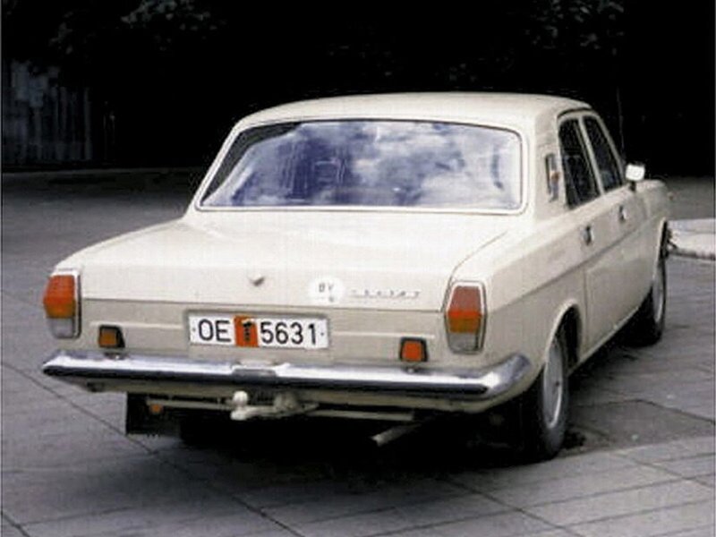 beige sedan car rear view
