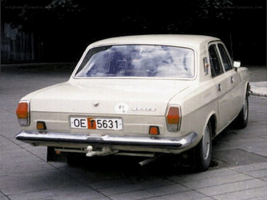 beige sedan car rear view