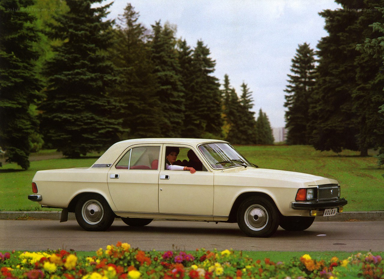 Beige sedan in park setting