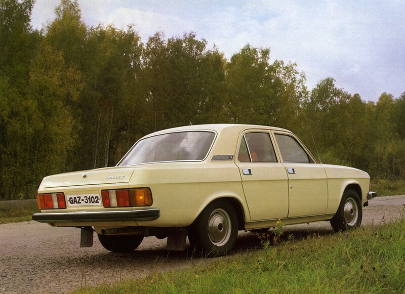 Beige sedan on a rural road