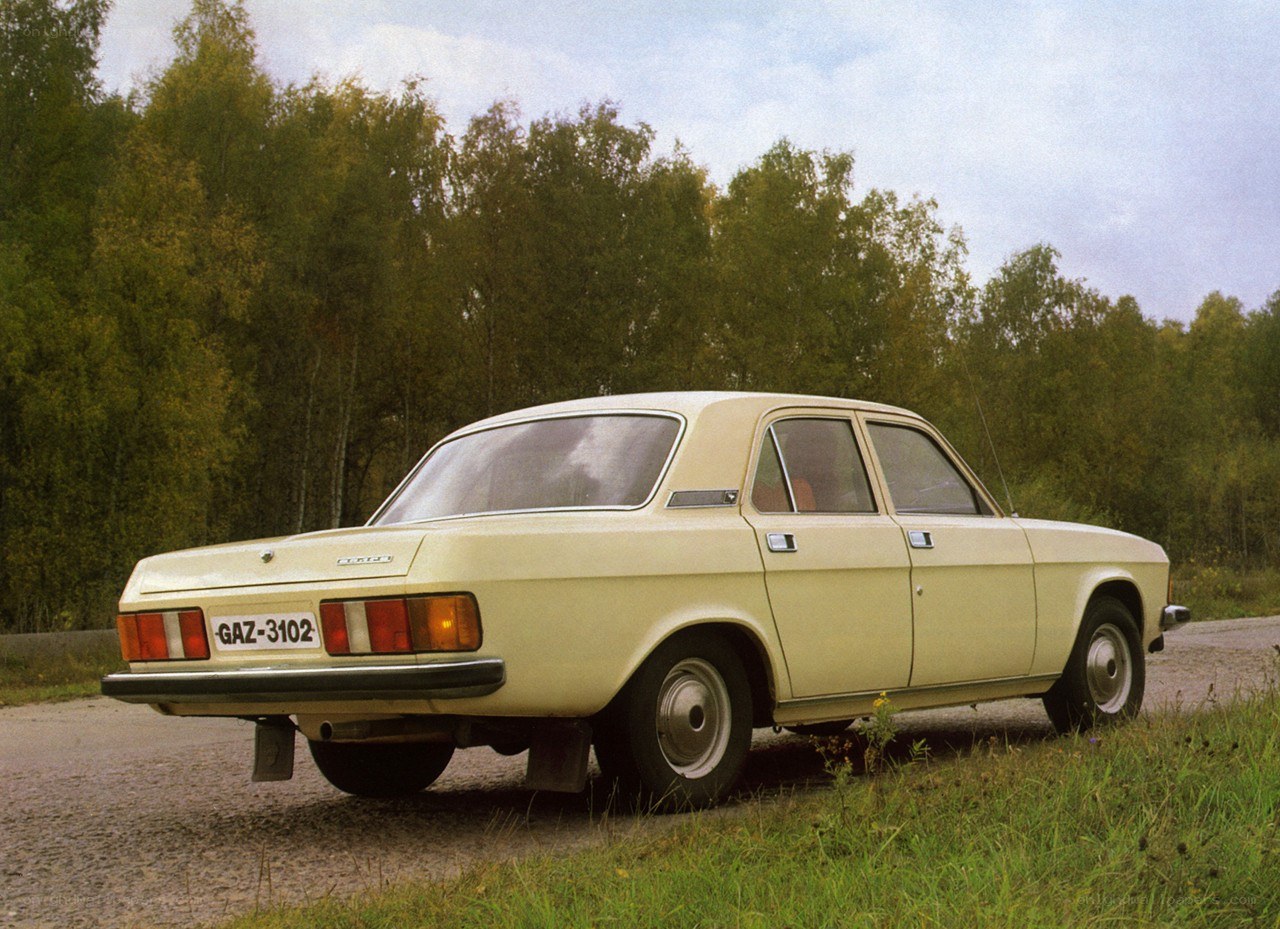 Beige sedan on a rural road