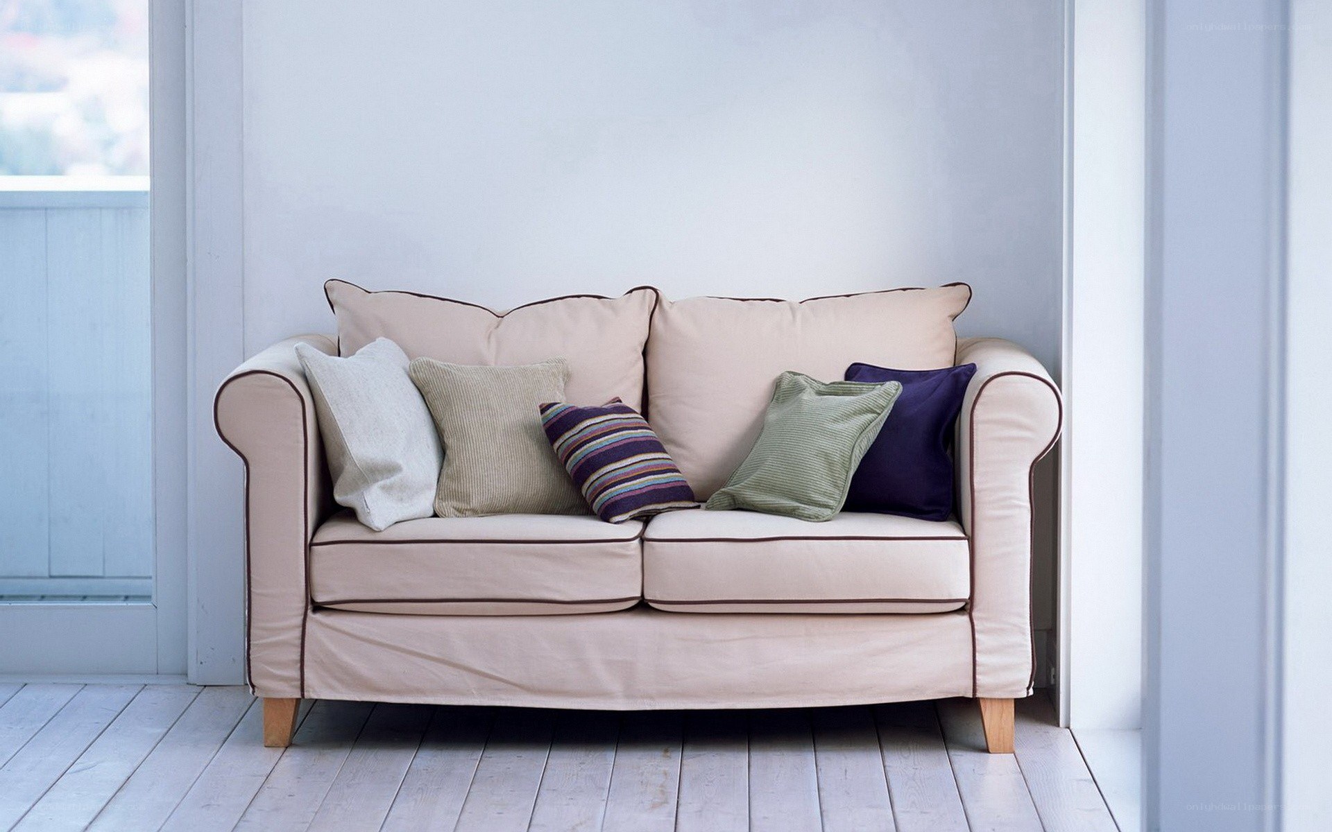 Beige sofa with decorative pillows