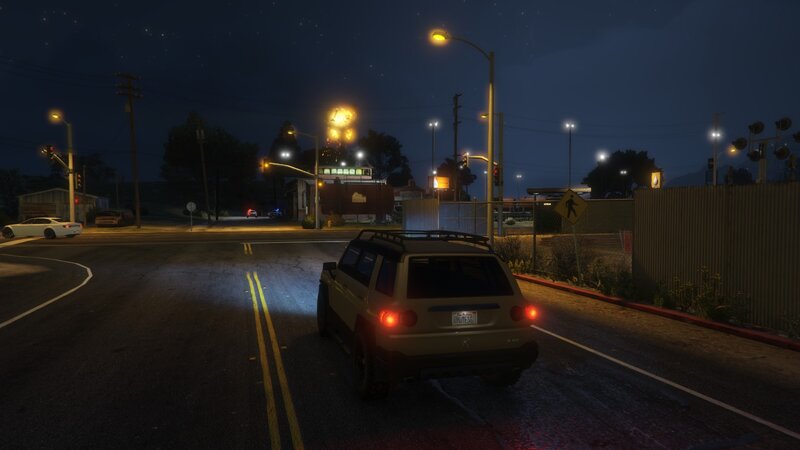 Beige SUV at Night