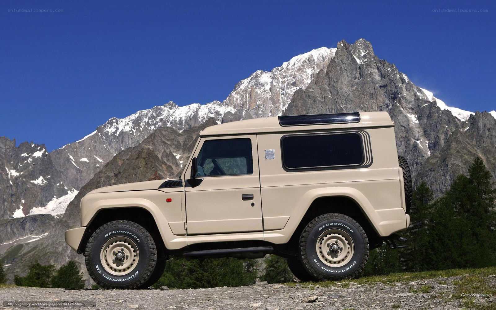Beige SUV in mountain landscape