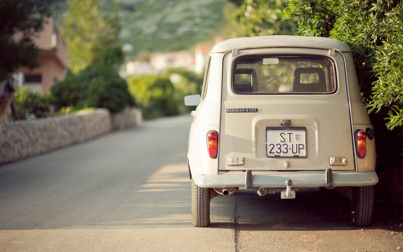Beige Vintage Car — Serene, Afternoon, Photograph, Road, Bush