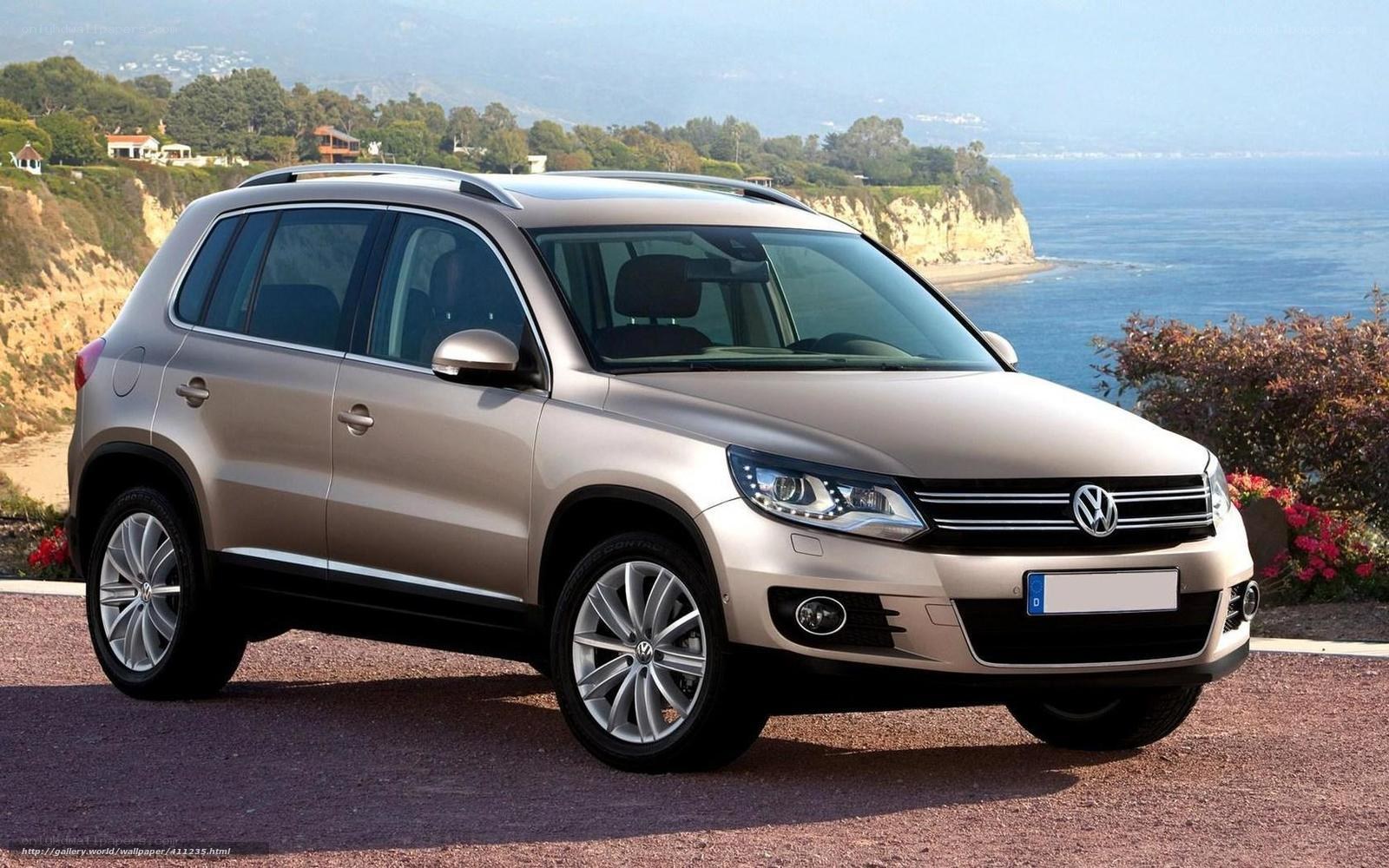 Beige Volkswagen Tiguan by the coast