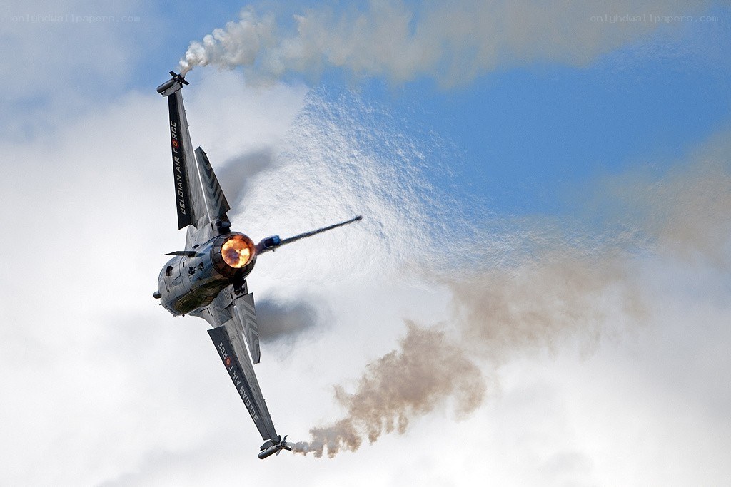 Belgian Air Force jet performing aerobatics