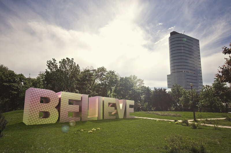 Believe sculpture in park