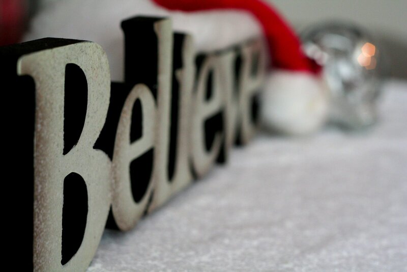 Believe sign with Santa hat
