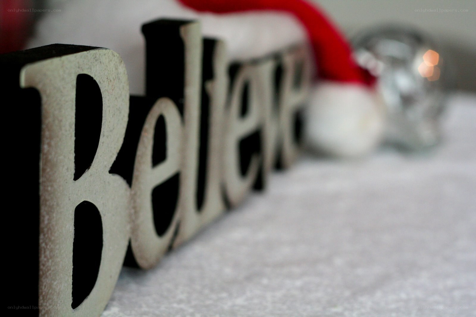 Believe sign with Santa hat