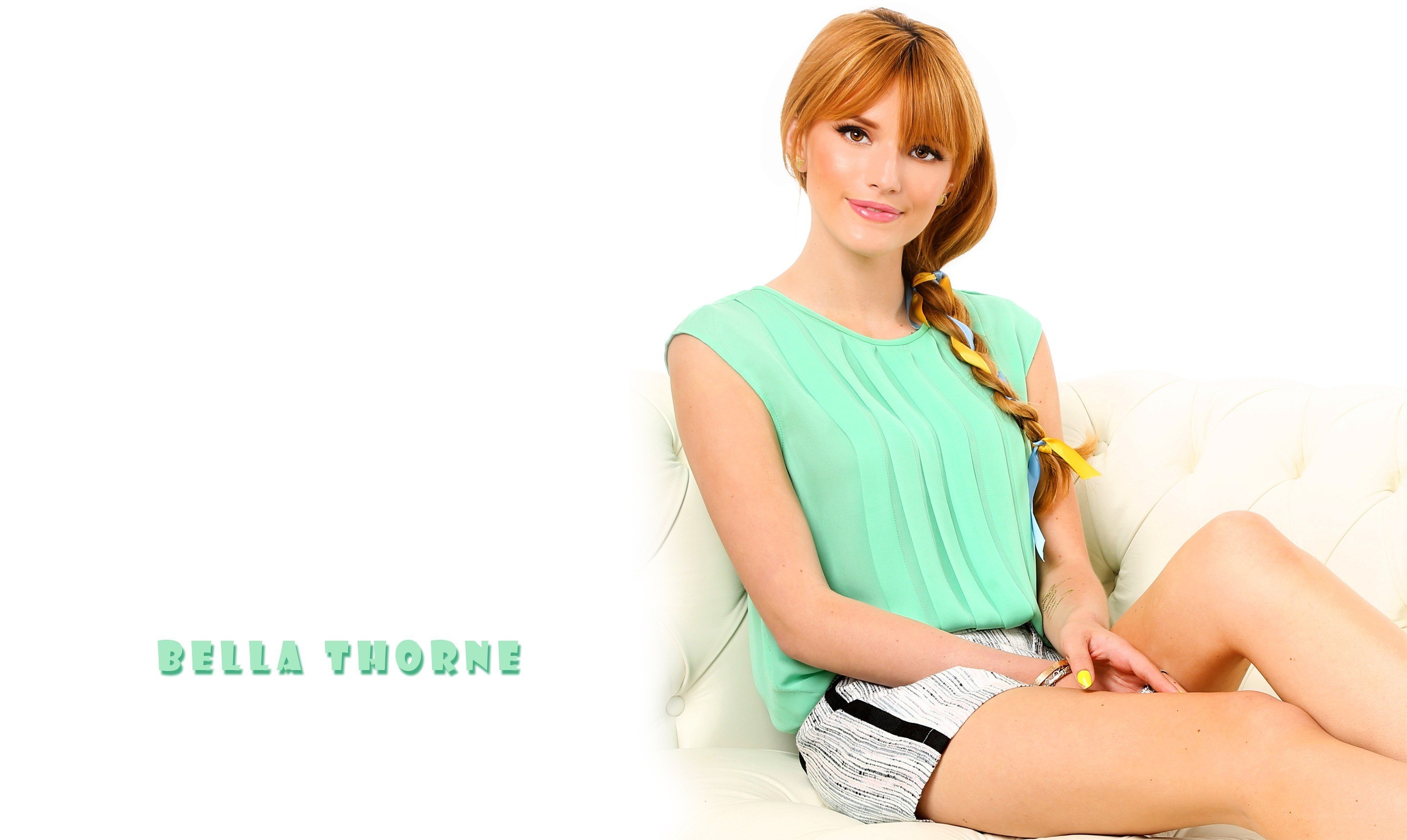 Bella Thorne on a white couch