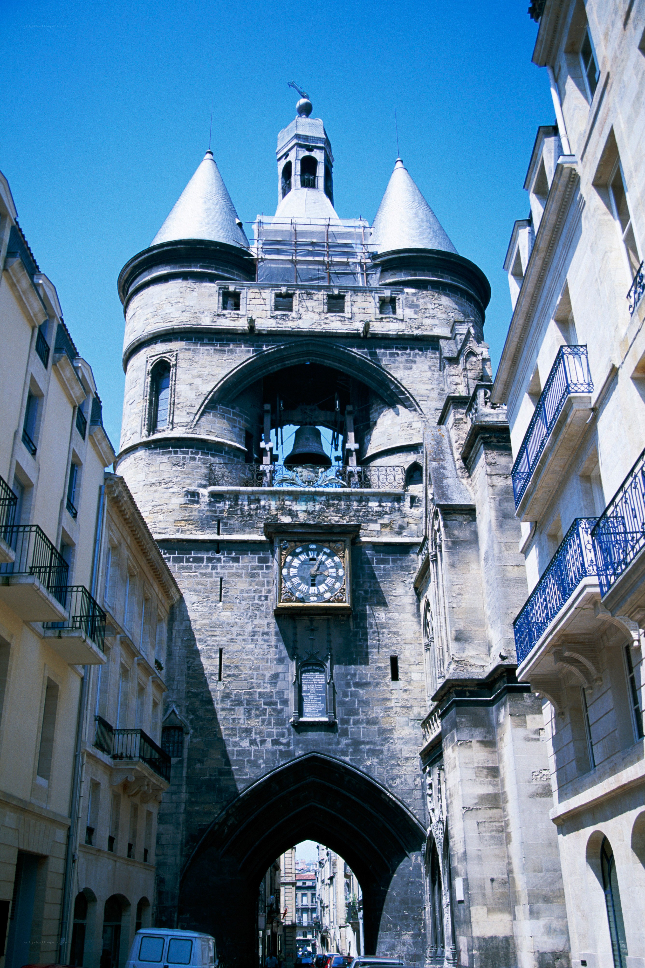 Bells and clock on a stone tower