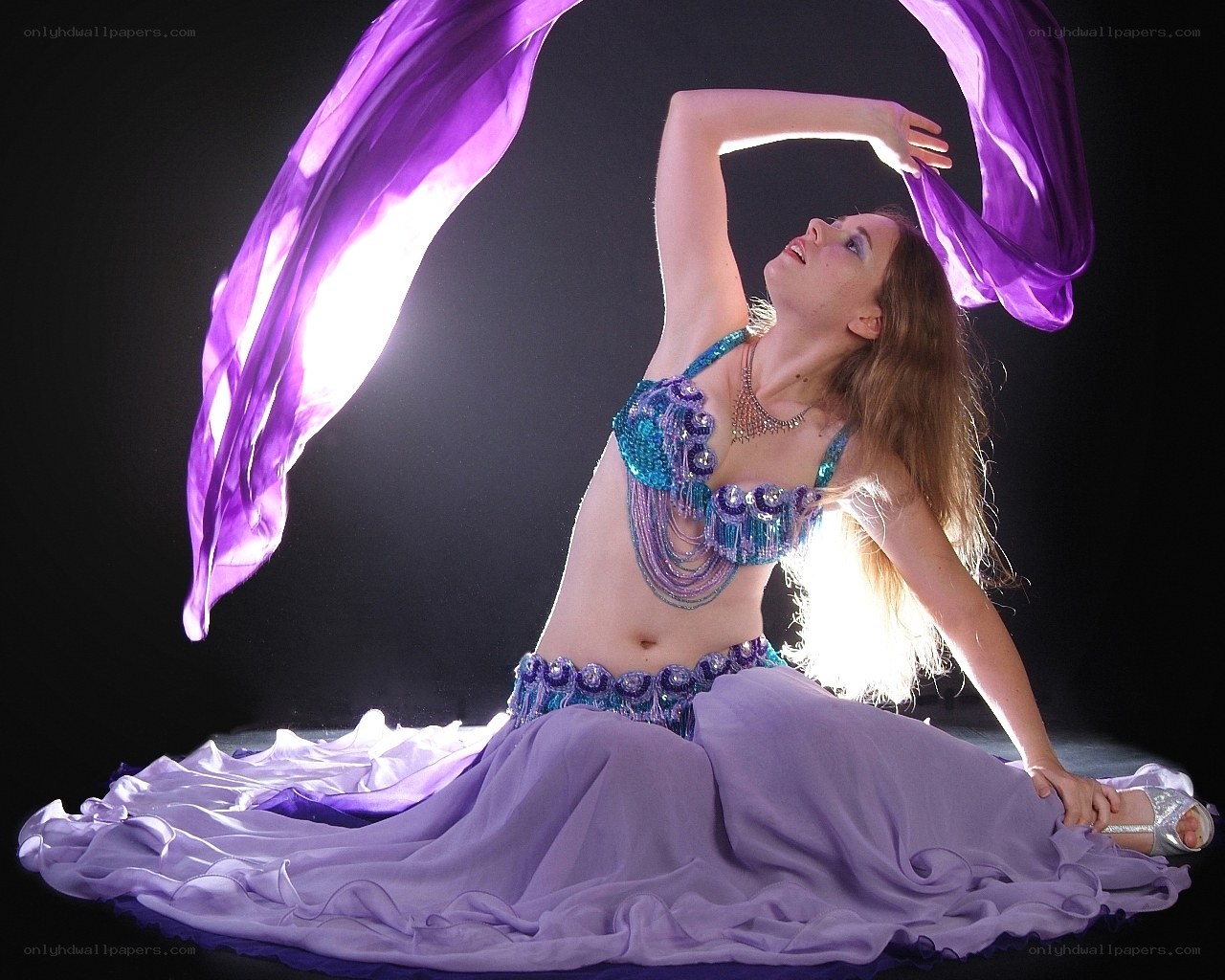 Belly dancer with purple scarf