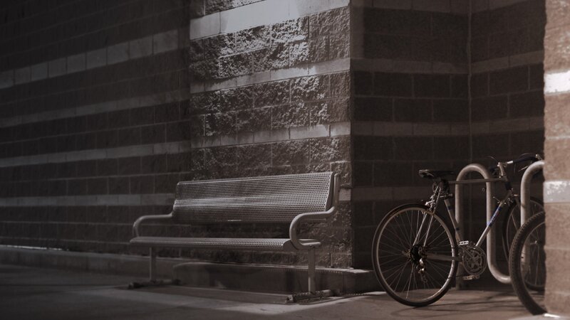 Bench and bicycle in alley