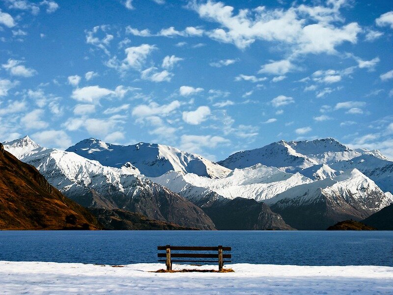 Bench by Lake and Mountains