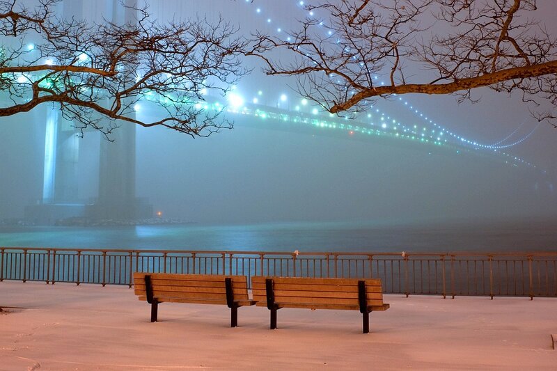 Bench by the foggy bridge