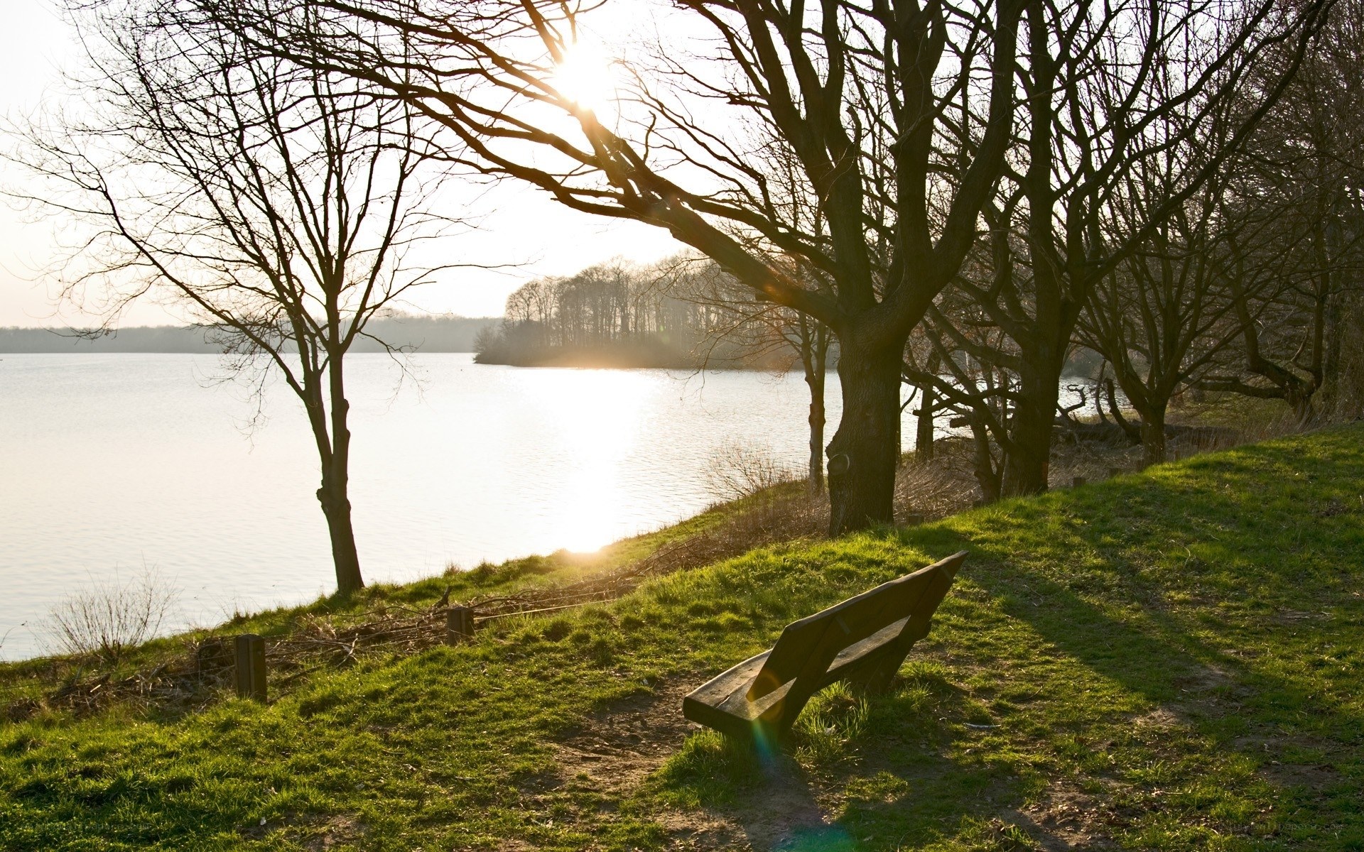 Bench by the lake at sunset