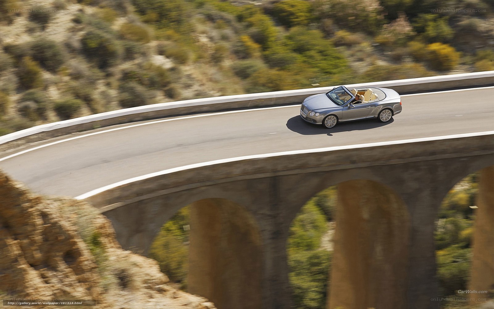 Bentley convertible on a bridge