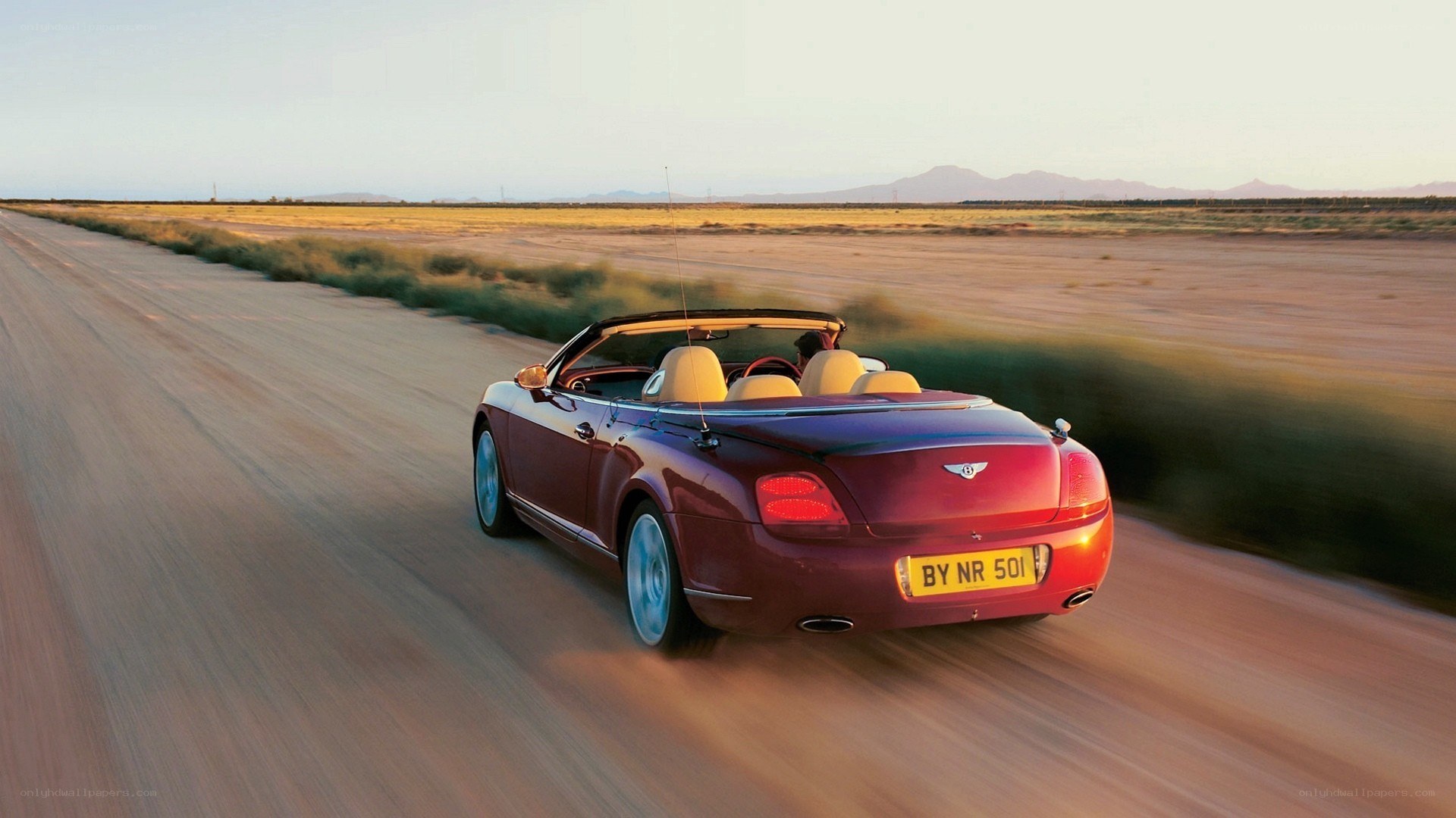 Bentley convertible on desert road