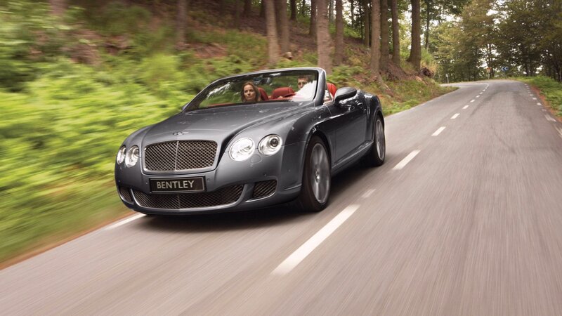 Bentley convertible on forest road