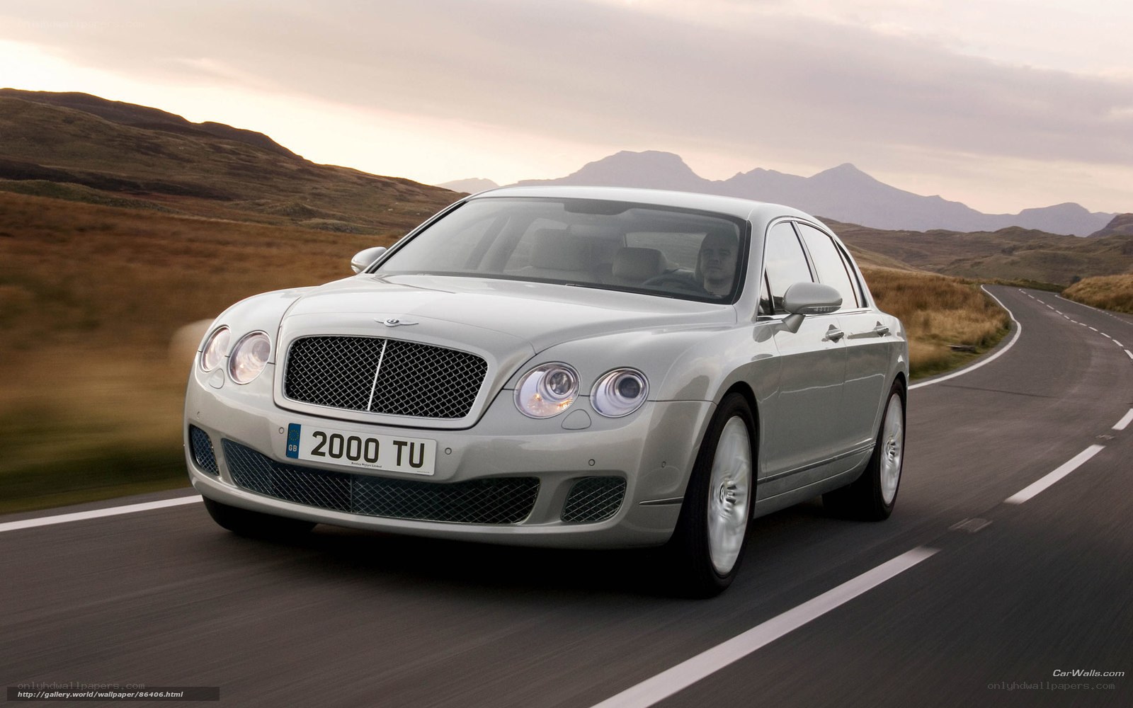 Bentley driving on a scenic road