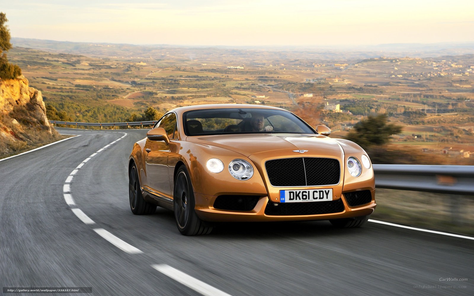 Bentley driving on a winding road