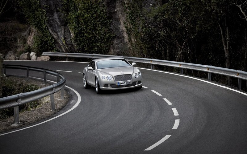 Bentley driving on a winding road