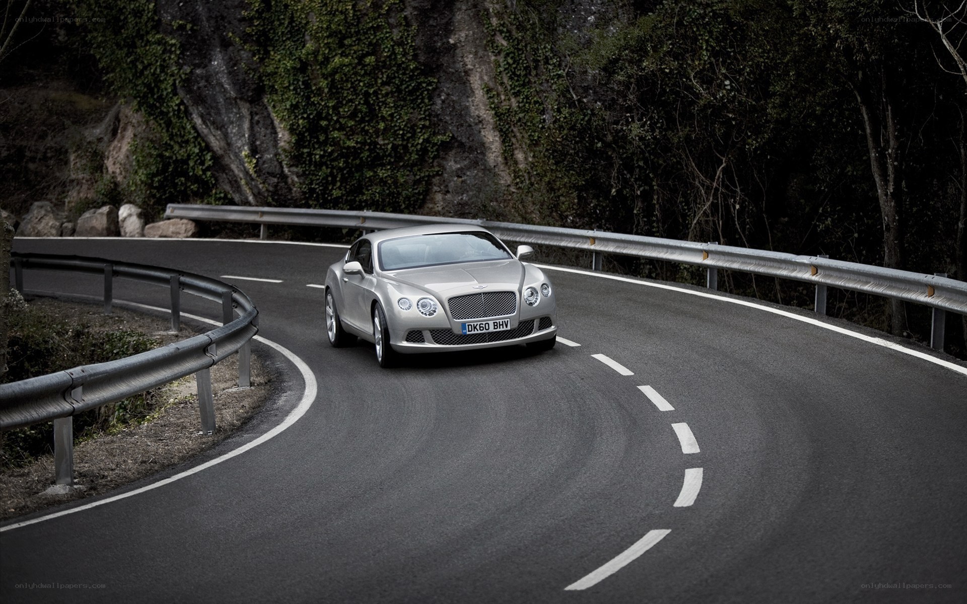 Bentley driving on a winding road