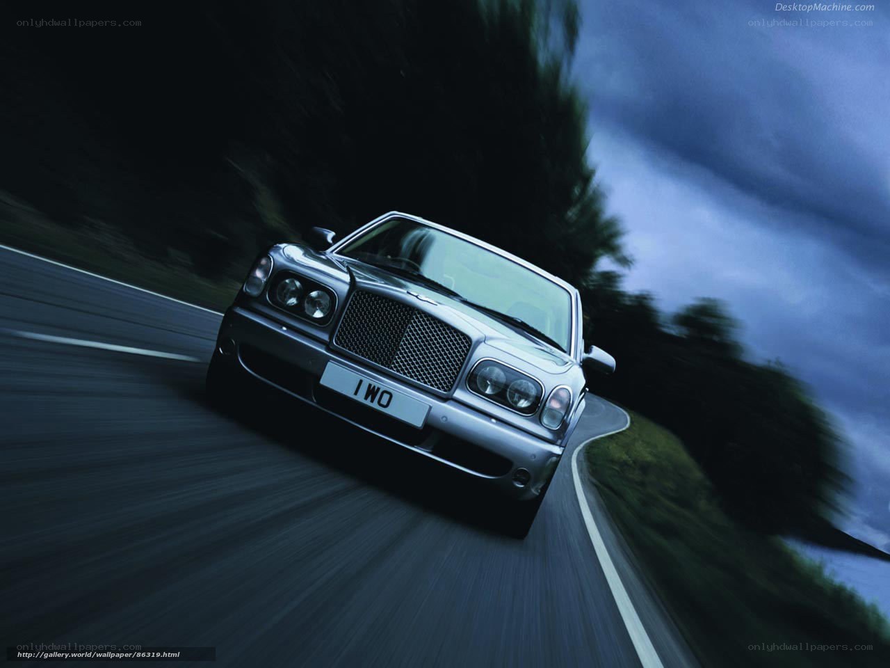 Bentley driving on a winding road